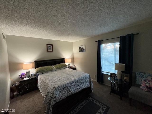 carpeted bedroom with a textured ceiling