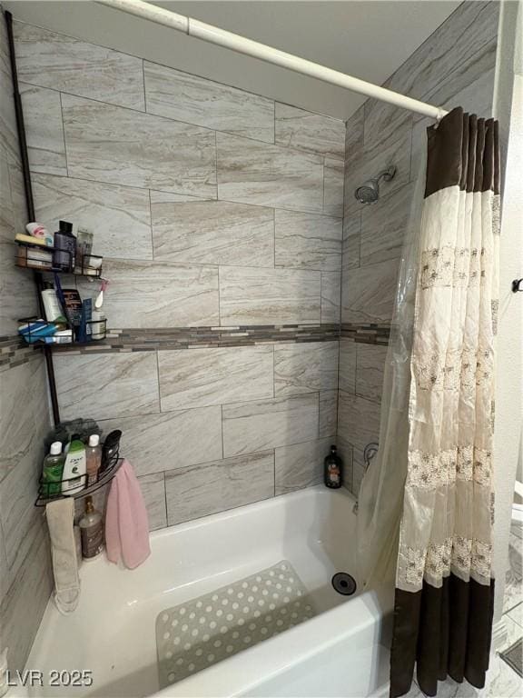 bathroom with shower / bathtub combination with curtain