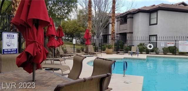 view of swimming pool featuring a patio