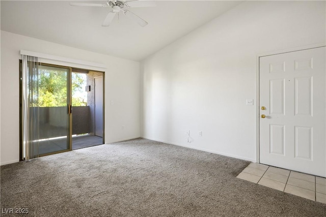 carpeted empty room with baseboards, a ceiling fan, lofted ceiling, and tile patterned flooring