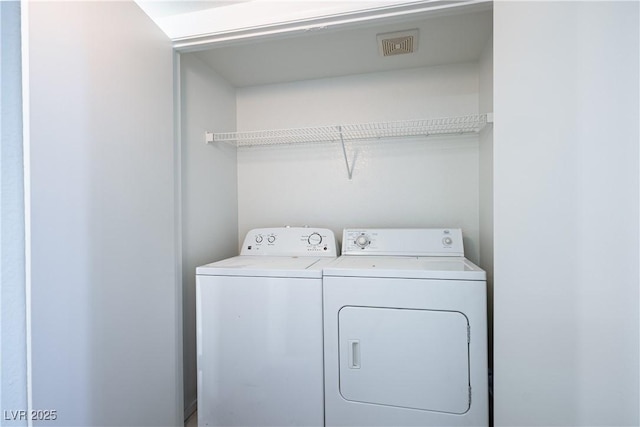 laundry room with independent washer and dryer, laundry area, and visible vents