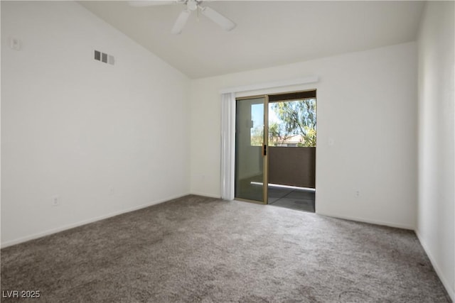 spare room featuring a ceiling fan, visible vents, lofted ceiling, and carpet