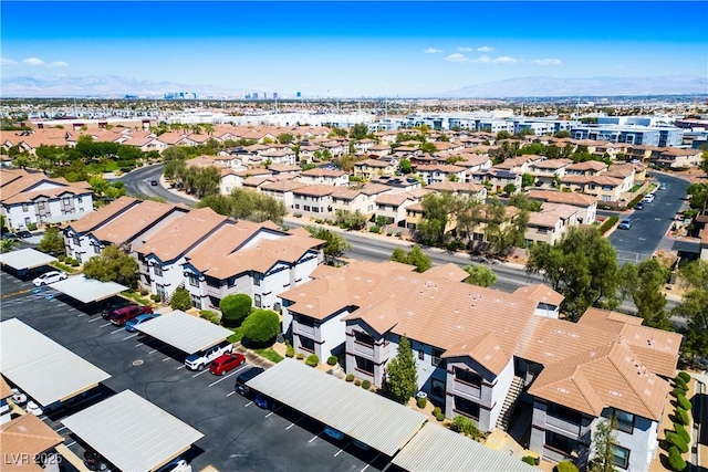 drone / aerial view featuring a residential view and a mountain view