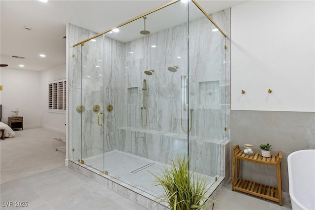 bathroom with shower with separate bathtub