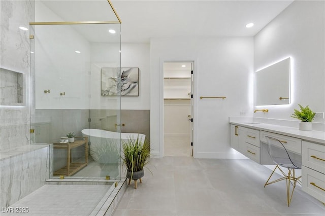 bathroom featuring vanity, concrete flooring, and independent shower and bath