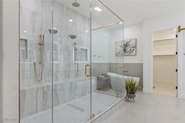 bathroom with tile patterned floors and separate shower and tub