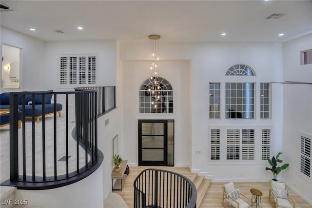 foyer featuring a chandelier and a high ceiling