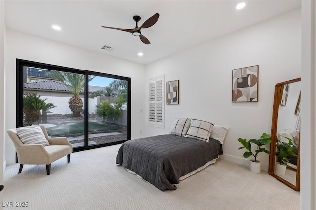 carpeted bedroom with ceiling fan and access to outside