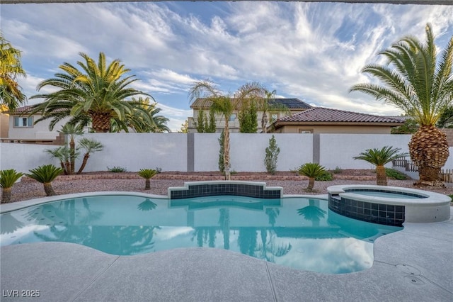 view of pool with an in ground hot tub