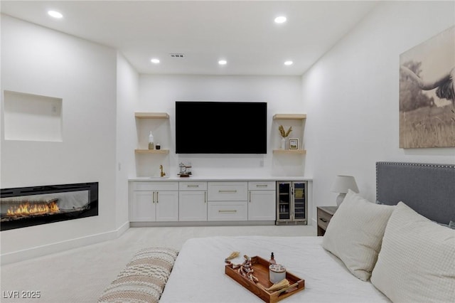 carpeted living room featuring wine cooler