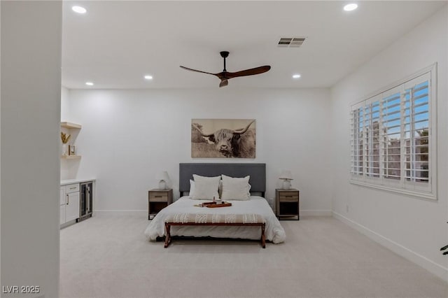 carpeted bedroom featuring ceiling fan and beverage cooler