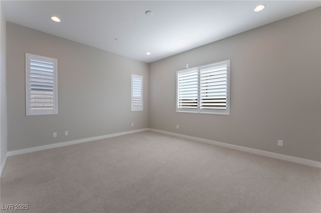 spare room with light colored carpet