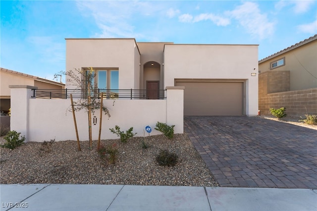 southwest-style home featuring a garage