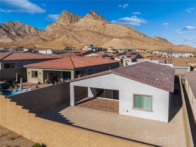 back of house featuring a mountain view