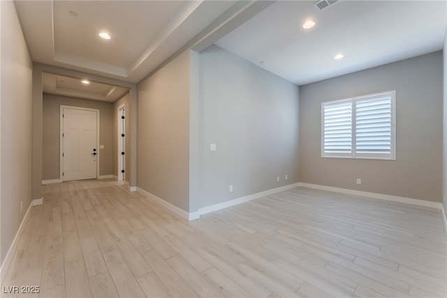 spare room with light hardwood / wood-style floors