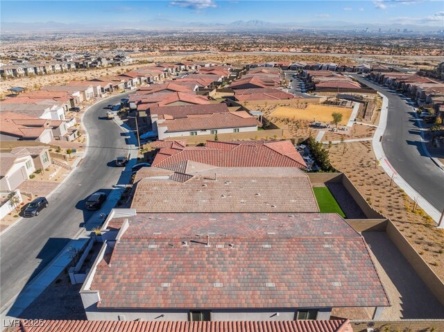 birds eye view of property with a mountain view