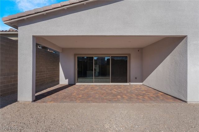 doorway to property featuring a patio area