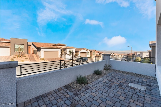 view of patio / terrace with a garage