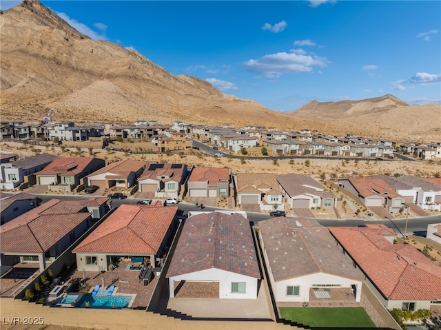 birds eye view of property featuring a mountain view