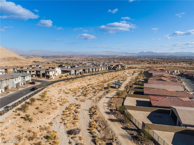 birds eye view of property with a mountain view