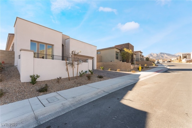 view of front of property with a mountain view