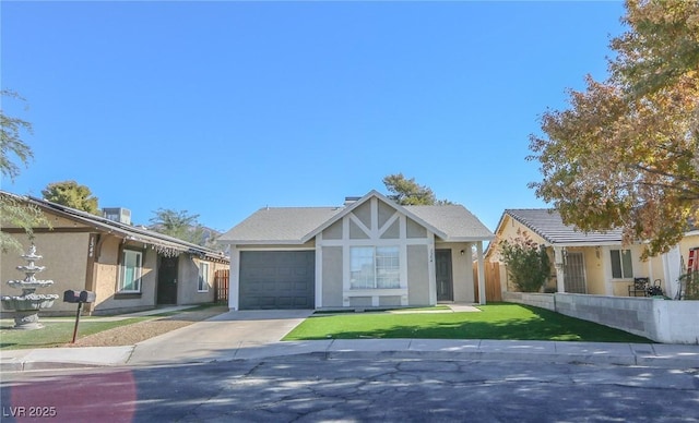 view of front of property featuring a garage and a front lawn