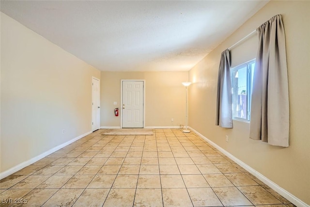 empty room with light tile patterned flooring