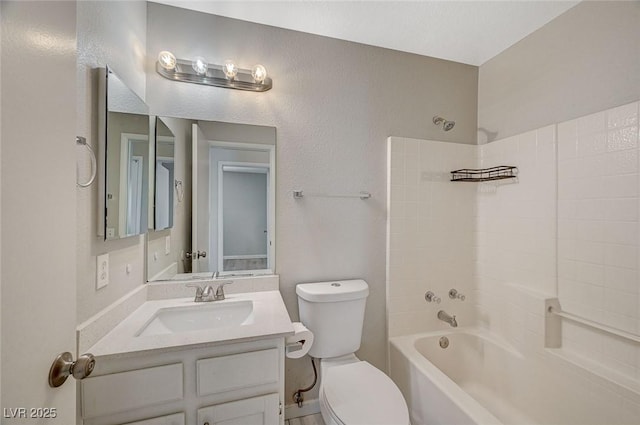 full bathroom featuring toilet, vanity, and tub / shower combination