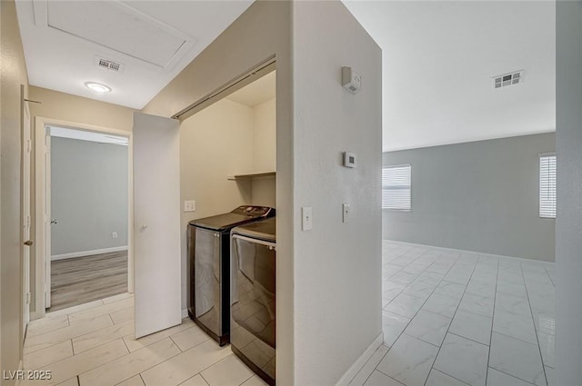 interior space with washing machine and clothes dryer