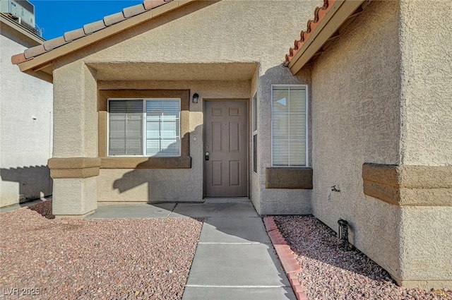 entrance to property with a patio