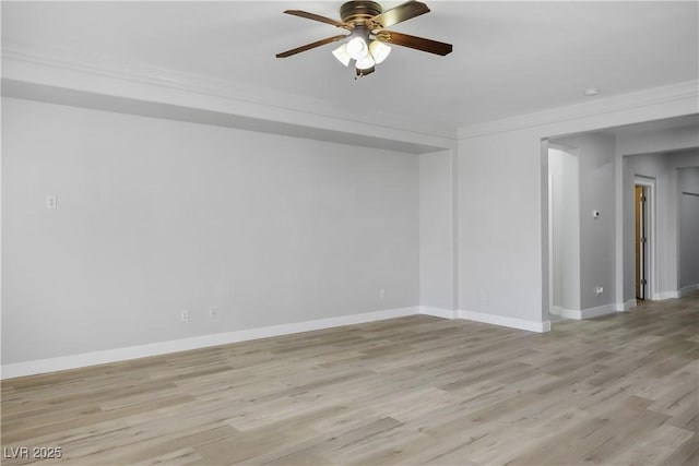 unfurnished room with light wood finished floors, a ceiling fan, and baseboards