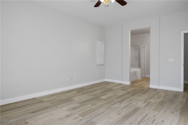 unfurnished bedroom featuring ensuite bath, ceiling fan, and light wood-type flooring