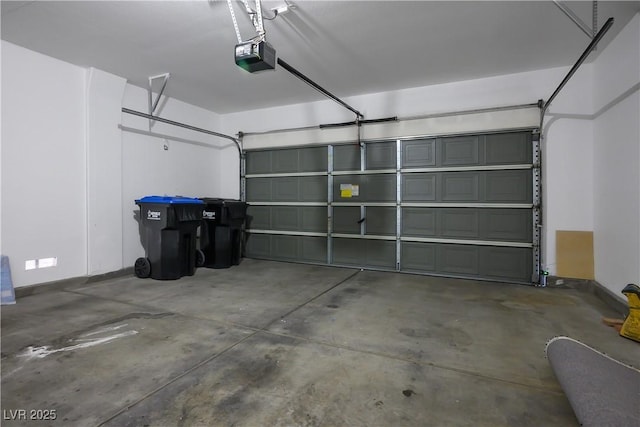 garage featuring a garage door opener