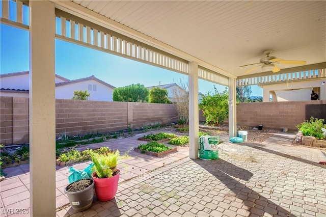 view of patio featuring a fenced backyard and ceiling fan