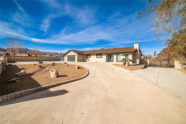 ranch-style house featuring a garage