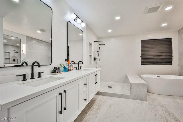 bathroom featuring vanity, separate shower and tub, and tile walls