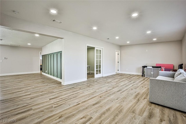 living room with light hardwood / wood-style floors