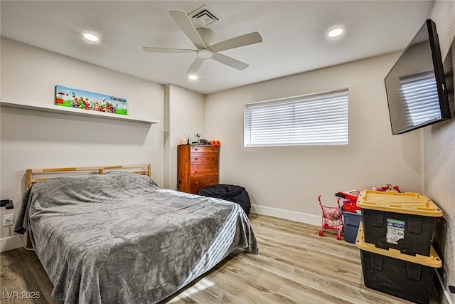 bedroom featuring ceiling fan and light hardwood / wood-style floors