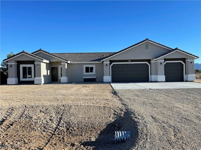 ranch-style home featuring a garage