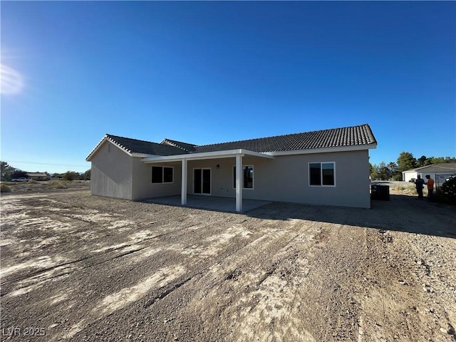 rear view of house with a patio area