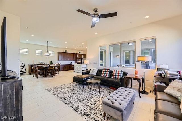 tiled living room featuring ceiling fan