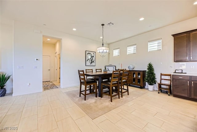 dining space featuring an inviting chandelier