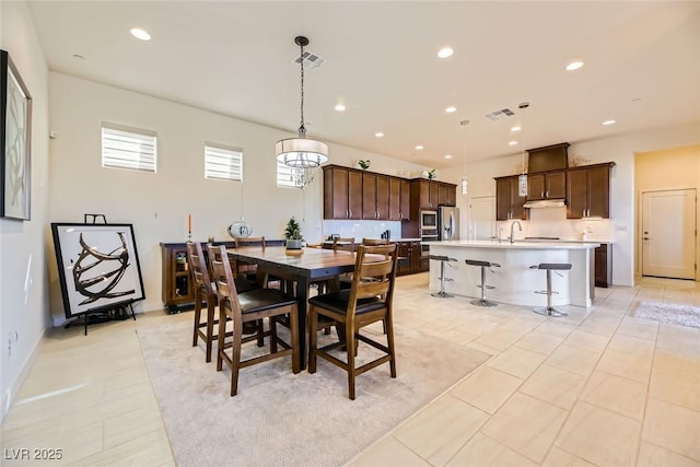 dining area featuring light tile patterned floors