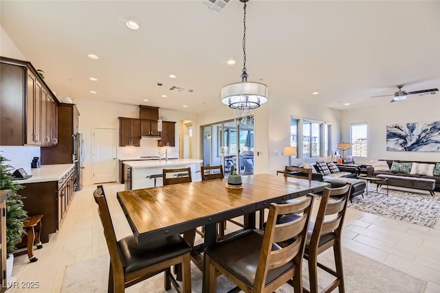 dining room with ceiling fan and light tile patterned floors