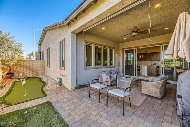 view of patio / terrace featuring ceiling fan