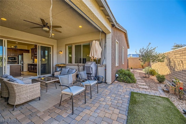 view of patio / terrace with ceiling fan and outdoor lounge area