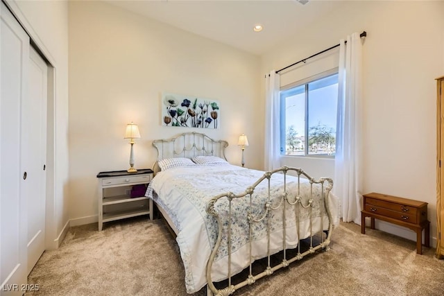 carpeted bedroom with a closet