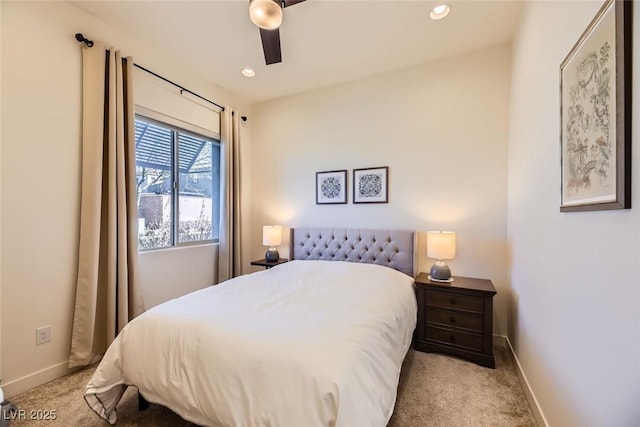 bedroom featuring ceiling fan and light carpet