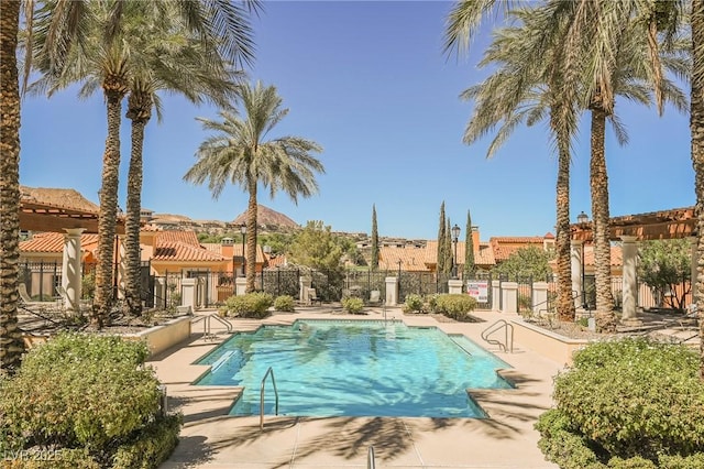 30 Strada Di Villaggio 115, Henderson, NV 89011 - community pool featuring a patio area and fence
