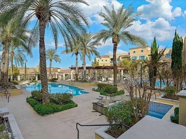 view of swimming pool with a patio area